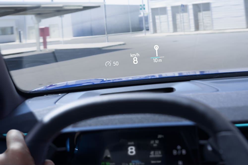 Close-up of the electric Ford Capri® head-up display showing key driving details.