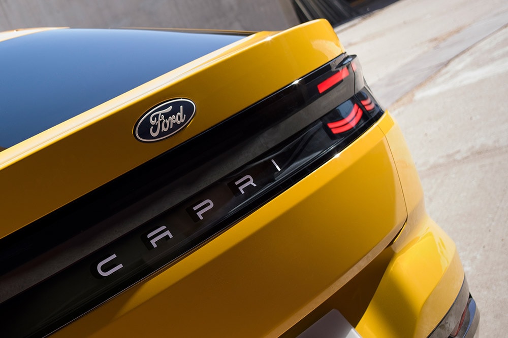 A close-up view of the CAPRI lettering on the rear of the new yellow Ford Capri® electrric SUV. 